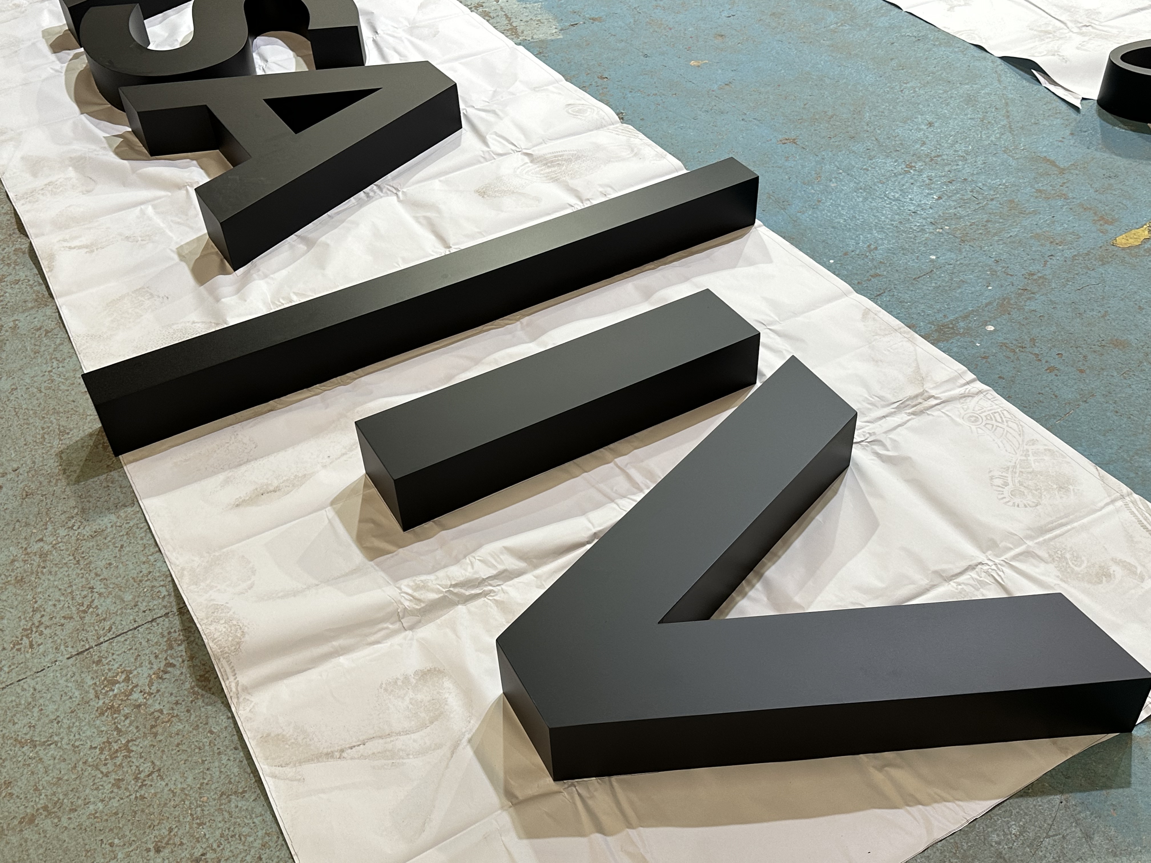 Metal letter detail for custom sign inquiry page